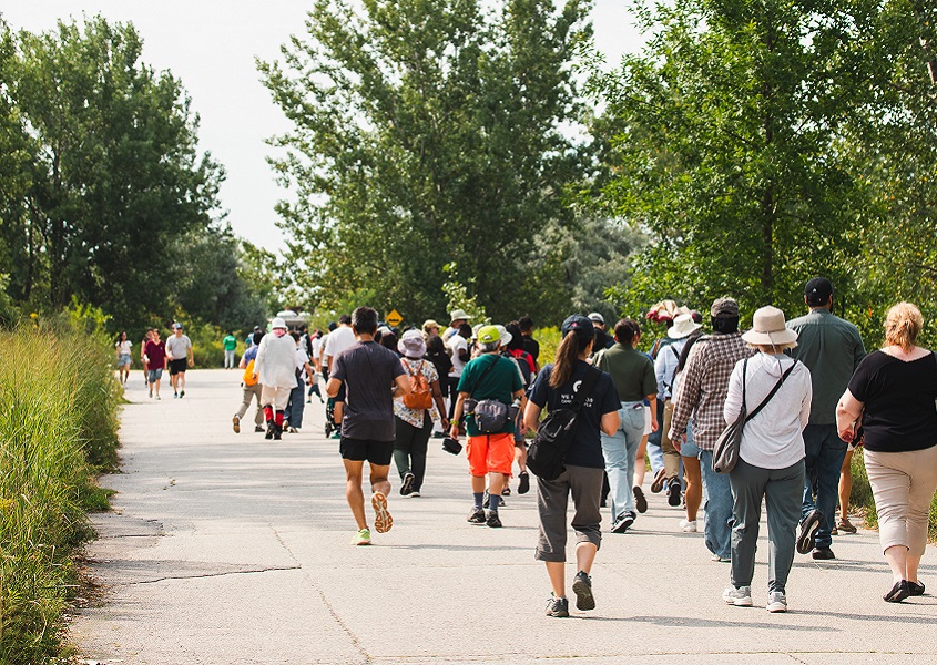 community members explore a trail at Tommy Thompson Park during the annual Butterfly Festival