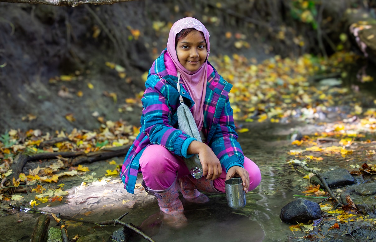 a student enjoys outdoor learning at The Nature School at the Toronto Zoo
