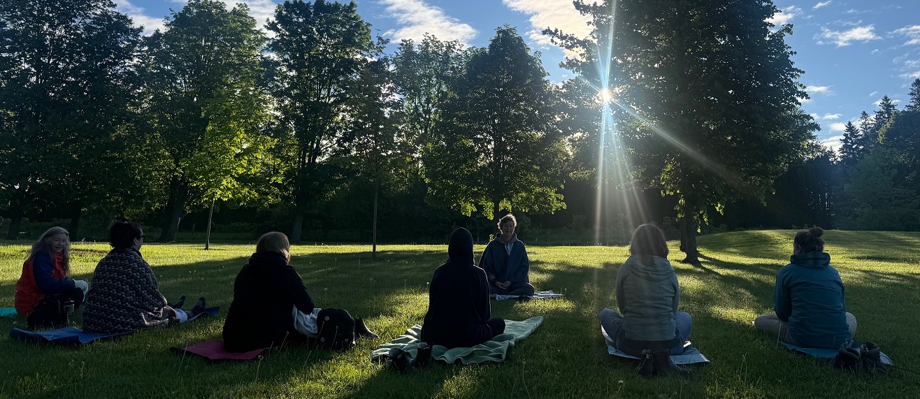 participants attending the womens wellness weekend retreat at Claremont Nature Centre enjoy an early morning outdoor yoga session