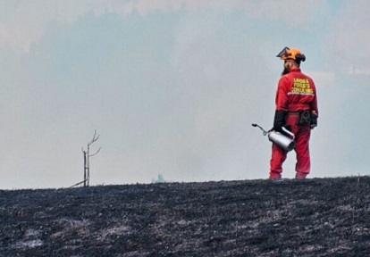 a TRCA team member oversees a prescribed burn at Albion Hills Conservation Park