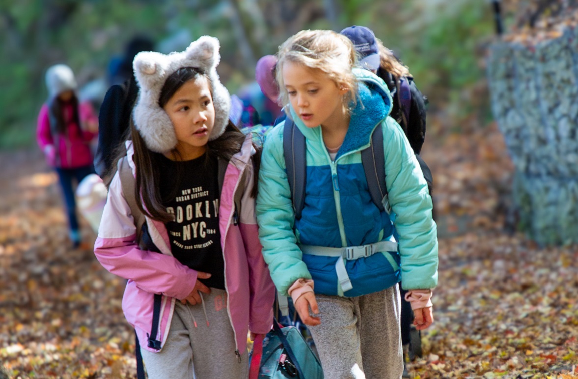 students in The Nature School at Bruces Mill explore a forest trail
