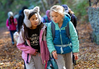 students in The Nature School at Bruces Mill explore a forest trail