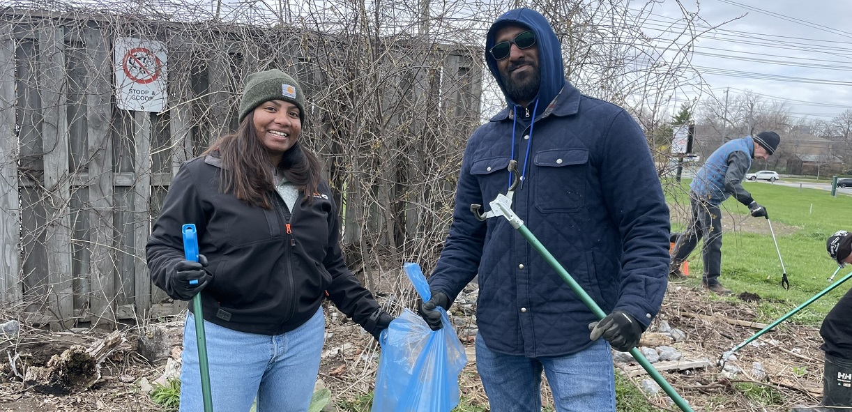 community members take part in an Earth Day clean-up event at The Meadoway