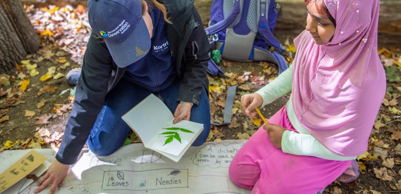a student and teacher take part in The Nature School Weekend program at Kortright Centre for Conservation