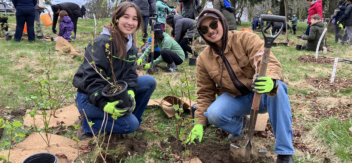 community members take part in an Earth Day planting event