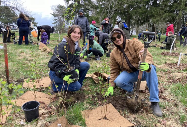 community members take part in an Earth Day planting event