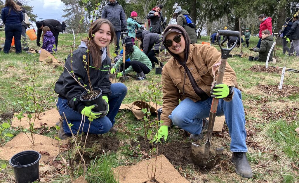 community members take part in an Earth Day planting event