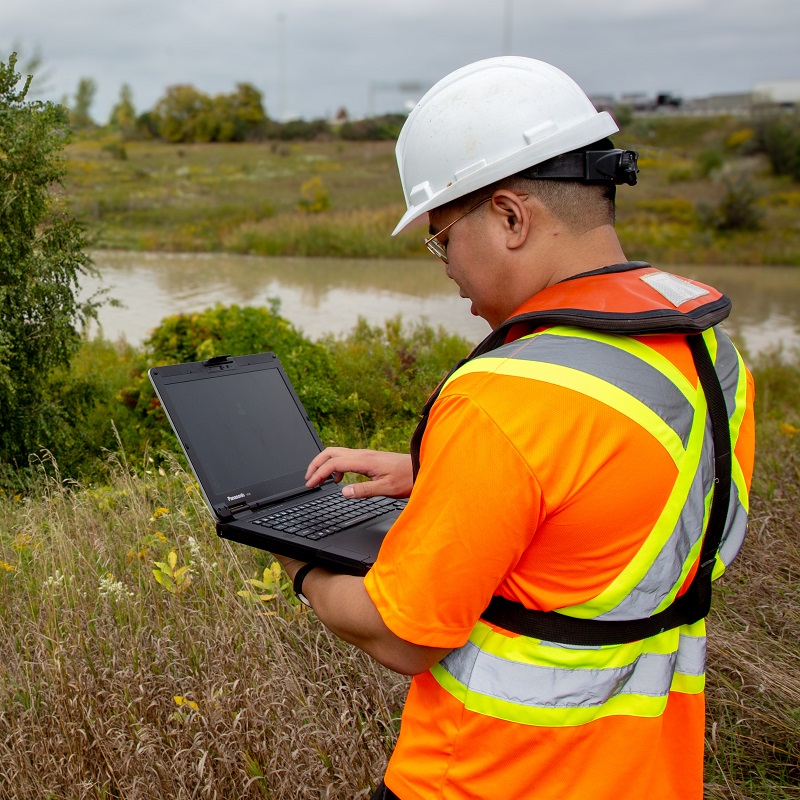 a member of the TRCA flood risk management team conducts field work