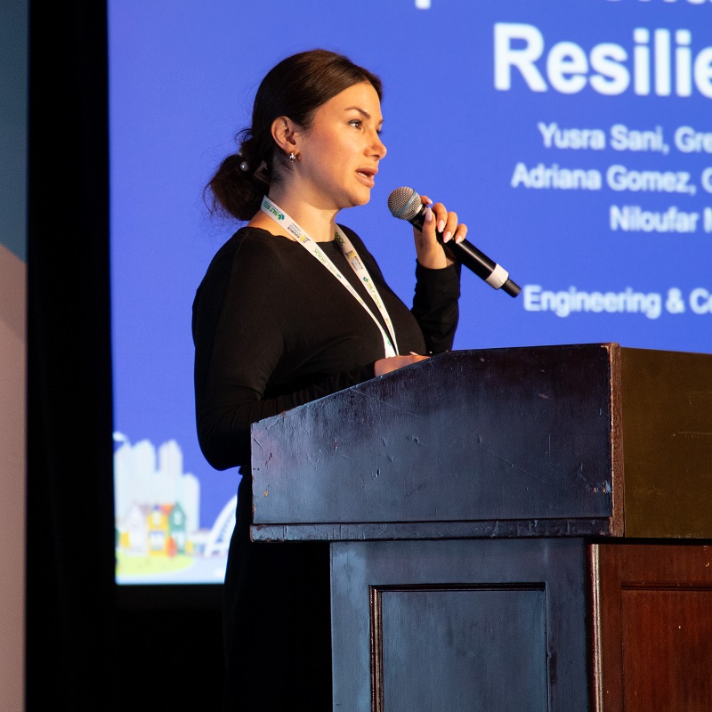 a speaker delivers a presentation at the annual Source to Stream conference