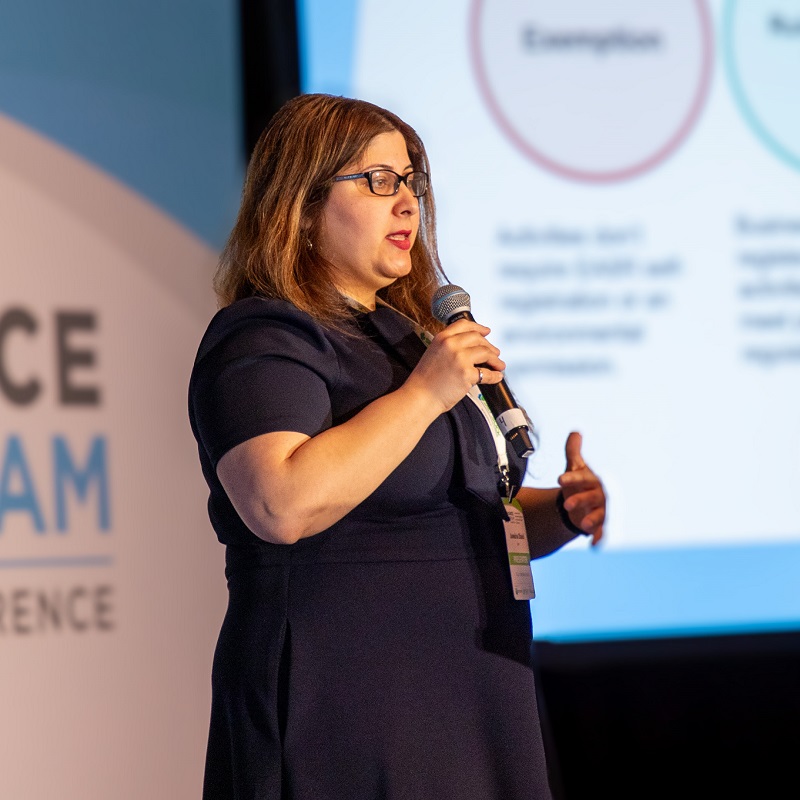 a speaker delivers a presentation at the annual Source to Stream conference