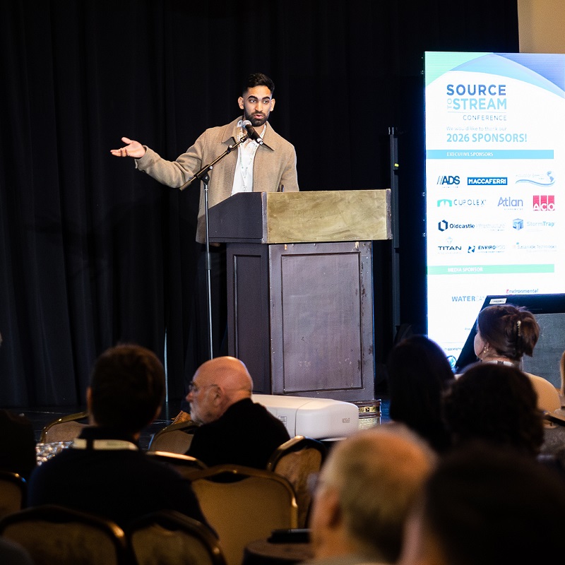 a speaker delivers a presentation at the annual Source to Stream conference