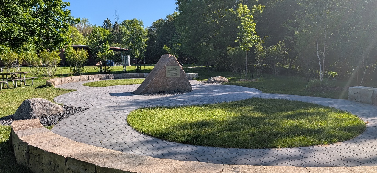 a view of the granite boulder at the centre of the Indigenous gathering space at Morningside Park