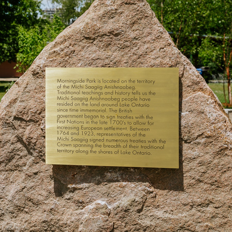 a Treaty plaque affixed to a boulder at the centre of the Indigenous gathering space at Morningside Park