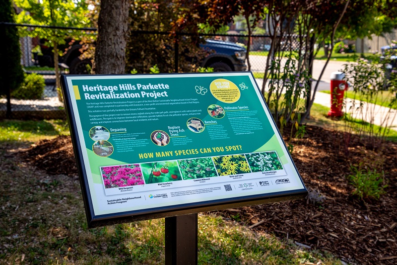 a new interpretive sign in the revitalized Heritage Hills Parkette in West Bolton 