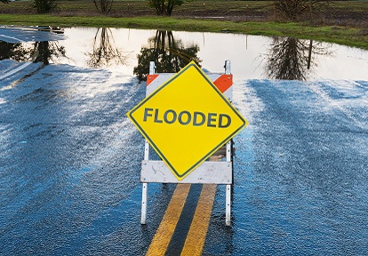 warning sign on a flooded roadway