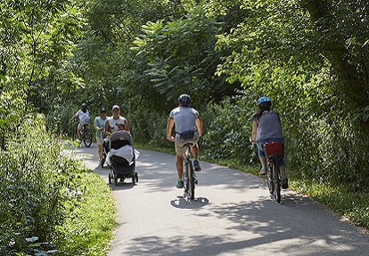 People walking and cycling along a trail in Toronto