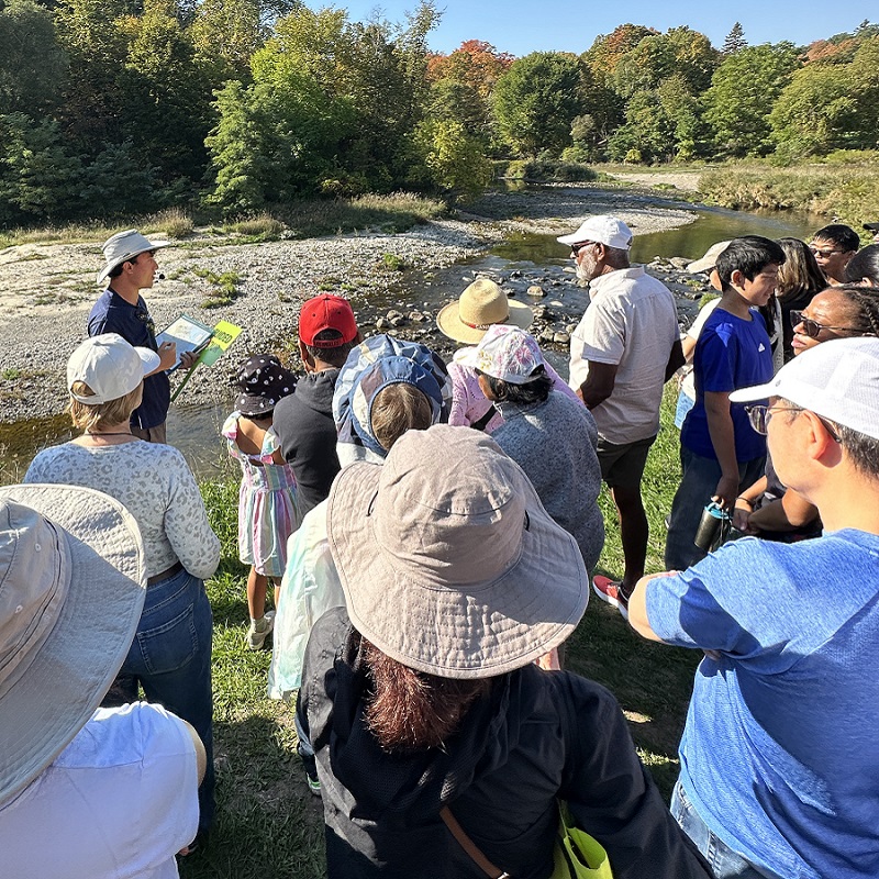 a TRCA team member leads a guided walk at the TRCA Adventures of Salmon event at Morningside Park