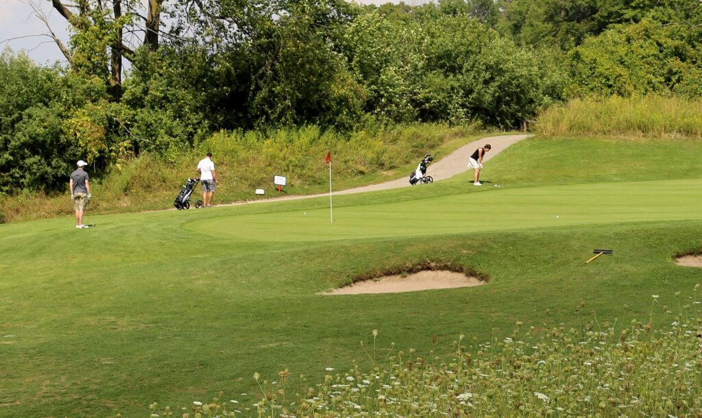 golfers play a round at Bathurst Glen Golf Course in Richmond Hill