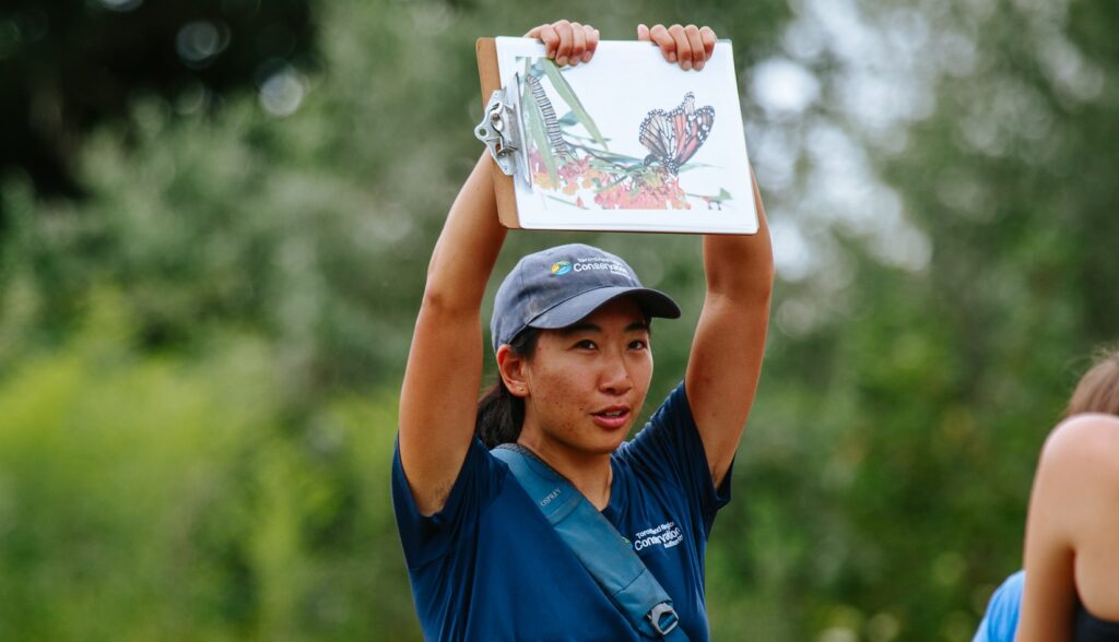 a TRCA team member leads a guided walk at the TRCA butterfly festival at Tommy Thompson Park