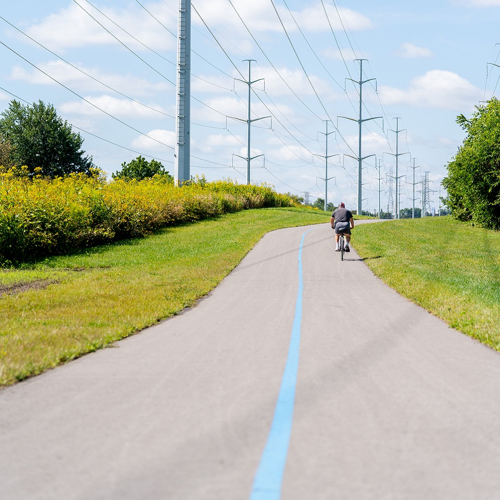 a cyclist explores the newly opened section 3 of The Meadoway