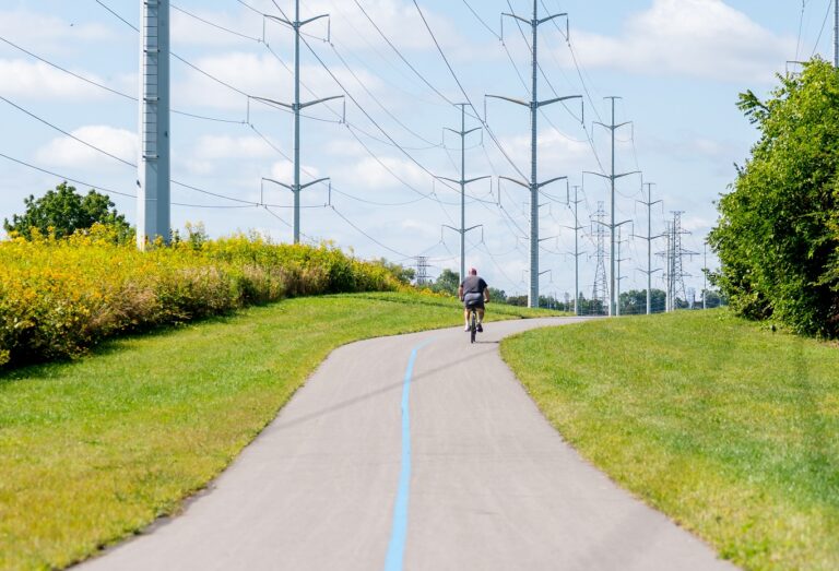 a cyclist explores the newly opened section 3 of The Meadoway