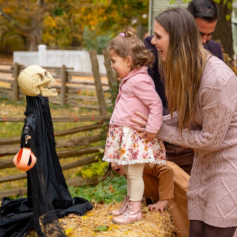a young family enjoys Halloween at the Village at Black Creek