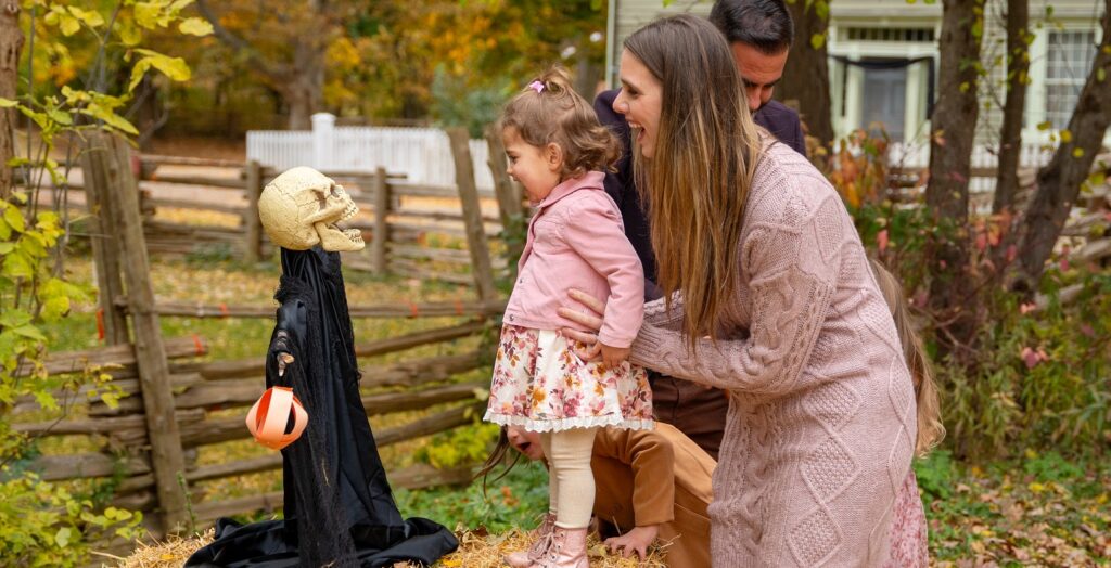a young family enjoys Halloween at the Village at Black Creek